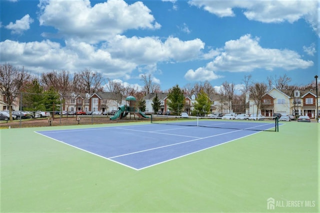 179 Sunshine Dr, Piscataway, NJ 08854 - view of tennis court with a residential view