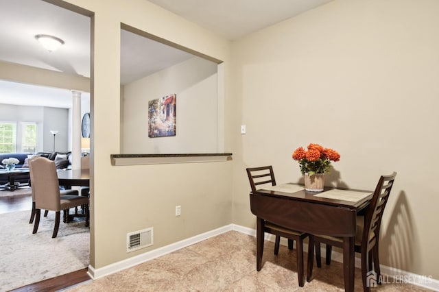 179 Sunshine Dr, Piscataway, NJ 08854 - dining space with decorative columns and baseboards