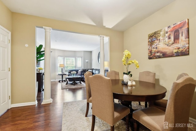 179 Sunshine Dr, Piscataway, NJ 08854 - dining area with ornate columns and dark wood-style flooring