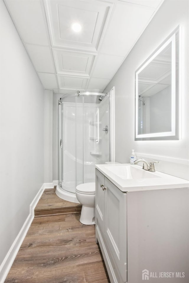 179 Sunshine Dr, Piscataway, NJ 08854 - full bathroom with vanity, a stall shower, and wood finished floors
