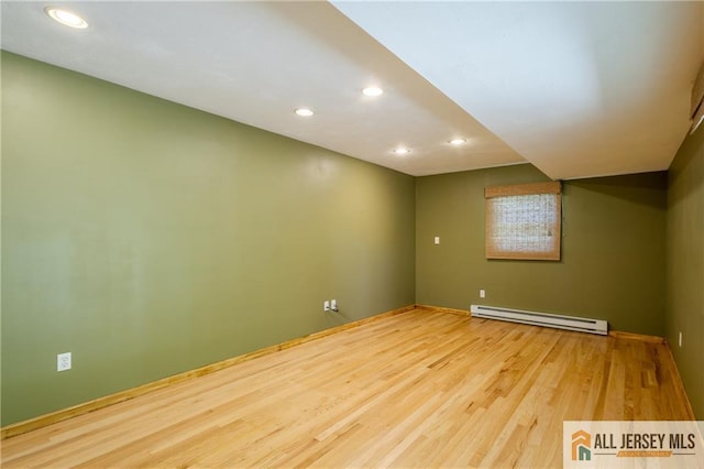 3 Revock Rd, East Brunswick, NJ 08816 - spare room with a baseboard radiator, wood finished floors, recessed lighting, and baseboards