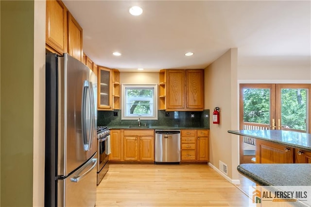 3 Revock Rd, East Brunswick, NJ 08816 - kitchen featuring appliances with stainless steel finishes, open shelves, light wood-style flooring, backsplash, and recessed lighting