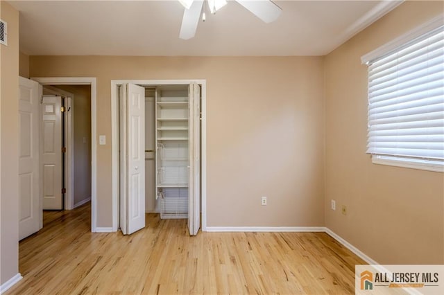 3 Revock Rd, East Brunswick, NJ 08816 - unfurnished bedroom featuring light wood-style flooring, baseboards, a closet, and a ceiling fan