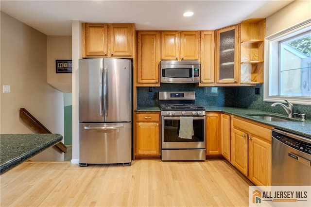 3 Revock Rd, East Brunswick, NJ 08816 - kitchen with stainless steel appliances, a sink, light wood finished floors, tasteful backsplash, and recessed lighting