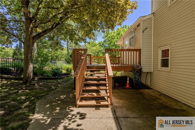 3 Revock Rd, East Brunswick, NJ 08816 - view of yard featuring stairway, a wooden deck, and a patio