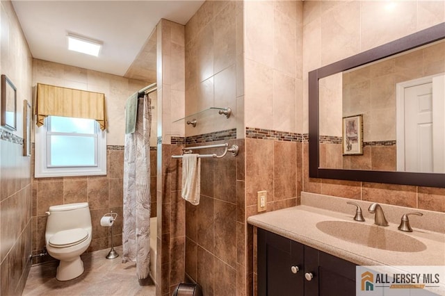 3 Revock Rd, East Brunswick, NJ 08816 - full bath with tile walls, toilet, tiled shower, vanity, and tile patterned floors