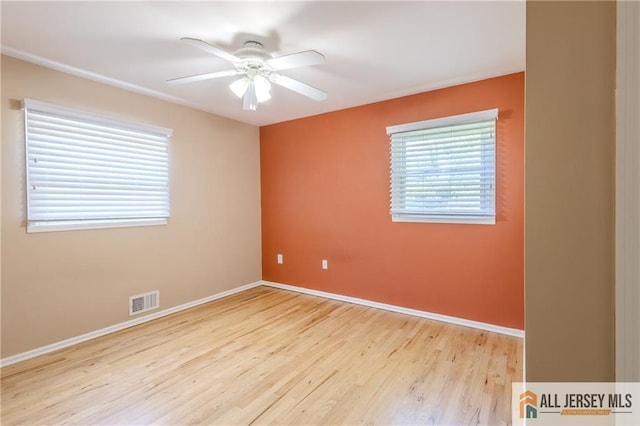 3 Revock Rd, East Brunswick, NJ 08816 - unfurnished room featuring wood finished floors, a ceiling fan, and baseboards