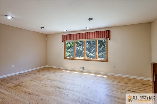 3 Revock Rd, East Brunswick, NJ 08816 - spare room featuring light wood-style floors and baseboards