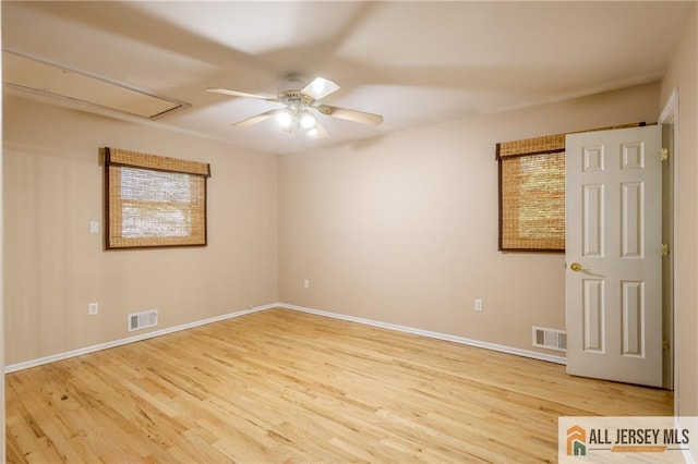 3 Revock Rd, East Brunswick, NJ 08816 - spare room featuring light wood-style floors, ceiling fan, and plenty of natural light