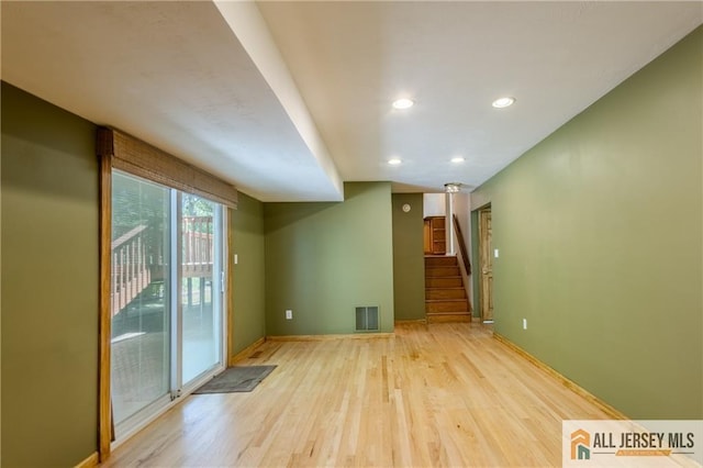 3 Revock Rd, East Brunswick, NJ 08816 - spare room featuring light wood-type flooring, stairs, baseboards, and recessed lighting