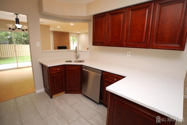 117 Nathan Dr, North Brunswick, NJ 08902 - kitchen featuring stainless steel dishwasher, reddish brown cabinets, light countertops, and recessed lighting