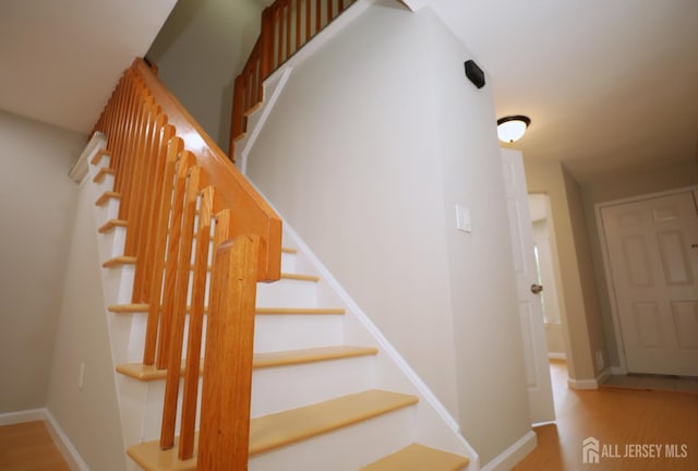 117 Nathan Dr, North Brunswick, NJ 08902 - staircase with wood finished floors and baseboards