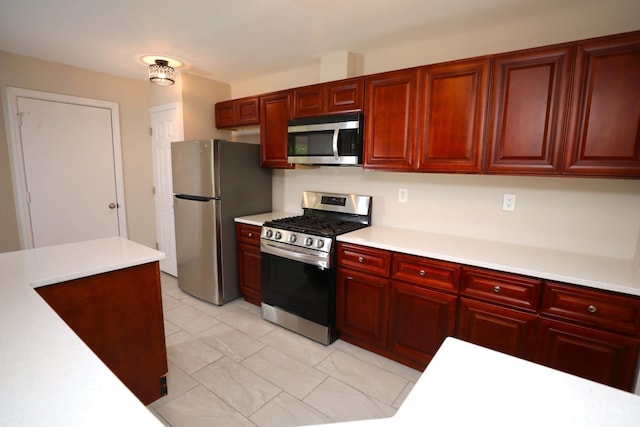 117 Nathan Dr, North Brunswick, NJ 08902 - kitchen with appliances with stainless steel finishes, dark brown cabinets, and light countertops