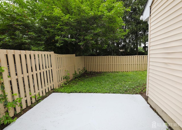 117 Nathan Dr, North Brunswick, NJ 08902 - fenced backyard with a patio area