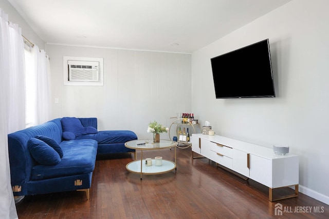 living area featuring a wall mounted AC and hardwood / wood-style floors