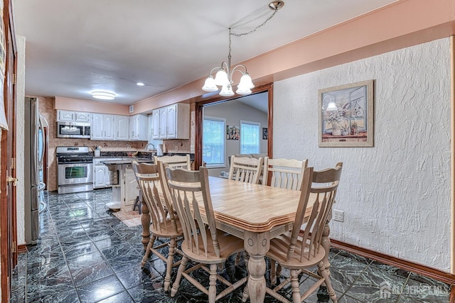 dining room featuring an inviting chandelier