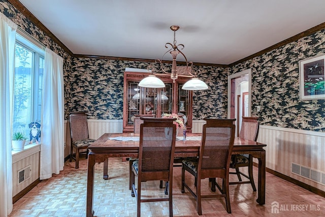 dining area featuring parquet floors