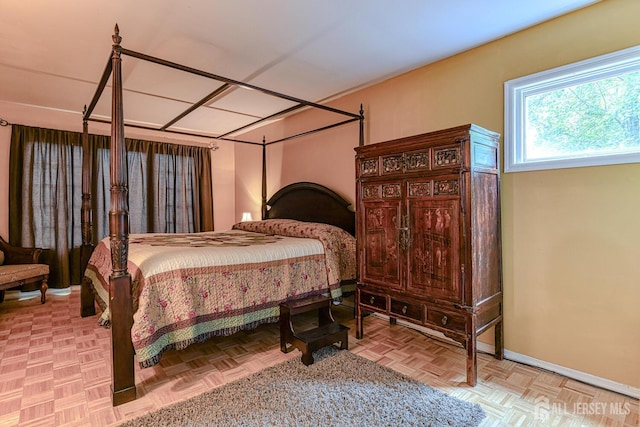 bedroom featuring light parquet flooring