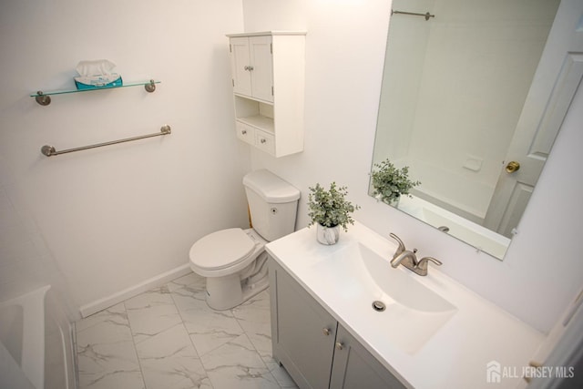 bathroom with marble finish floor, shower / washtub combination, toilet, vanity, and baseboards