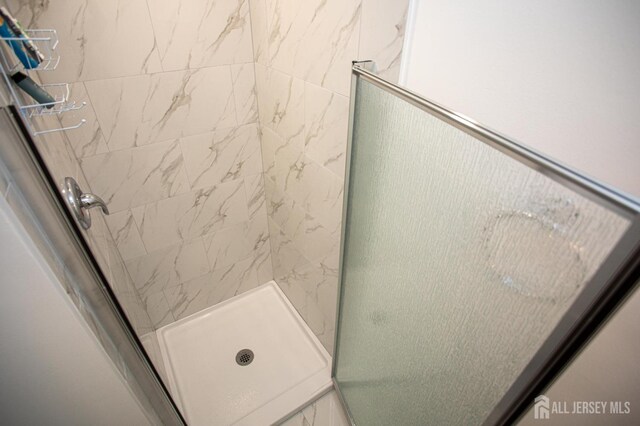 full bathroom with a shower stall