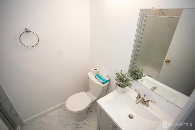 full bath featuring marble finish floor, an enclosed shower, toilet, vanity, and baseboards