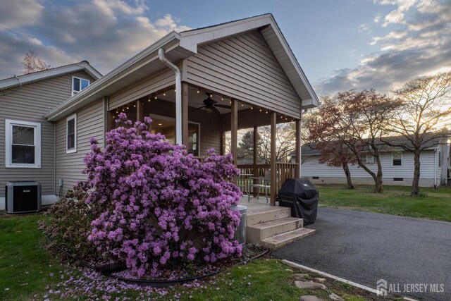 82 Hauser Ave, Hamilton, NJ 08620 - view of side of home with ceiling fan and a yard