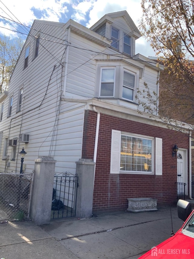 1065 S Clinton Ave, Trenton, NJ 08611 - view of side of home with brick siding and a gate