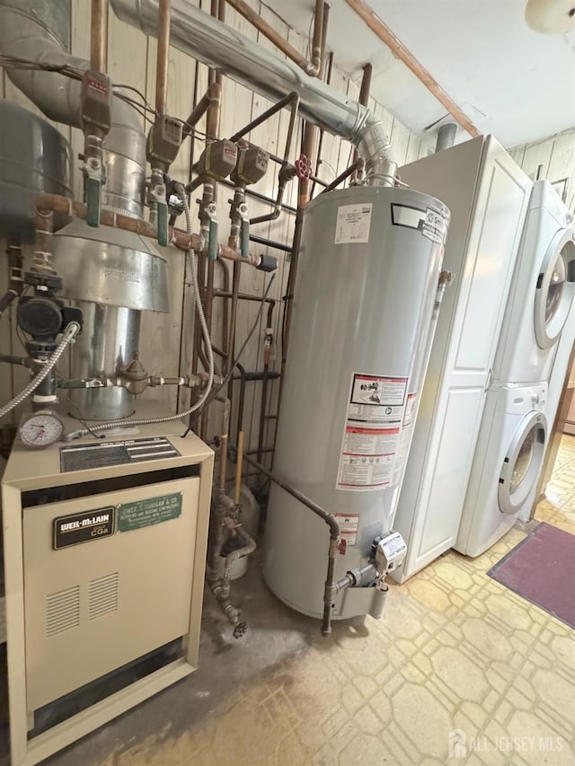 utility room with estacked washer and dryer and water heater