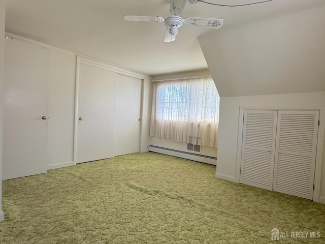 unfurnished bedroom with a baseboard radiator, carpet floors, and a ceiling fan