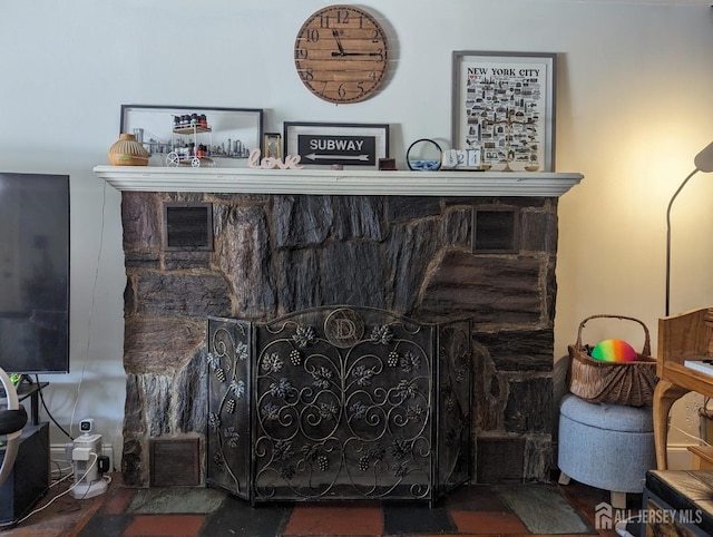 room details featuring a fireplace and visible vents