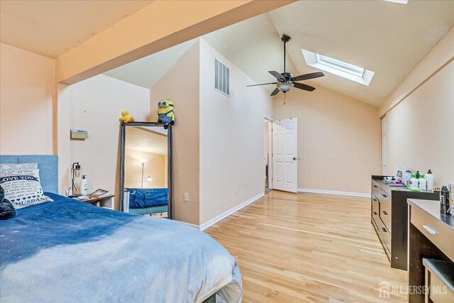 121-F Beverly Hill Ter, Woodbridge Proper, NJ 07095 - bedroom featuring a skylight, light wood-style flooring, and high vaulted ceiling