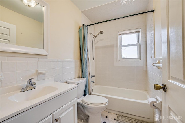 121-F Beverly Hill Ter, Woodbridge Proper, NJ 07095 - full bathroom featuring tile walls, vanity, shower / bathtub combination with curtain, and a wainscoted wall