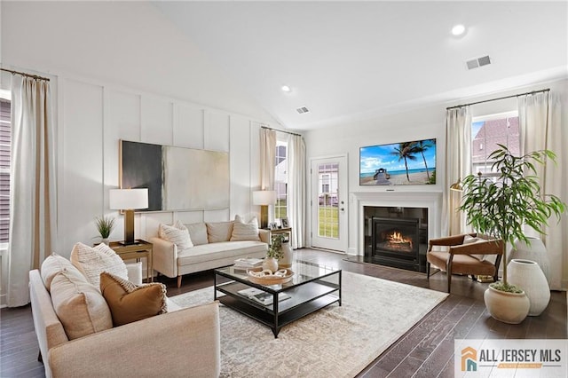 15 Galerie Ct, Monroe, NJ 08831 - living area featuring dark wood finished floors, a glass covered fireplace, recessed lighting, and lofted ceiling