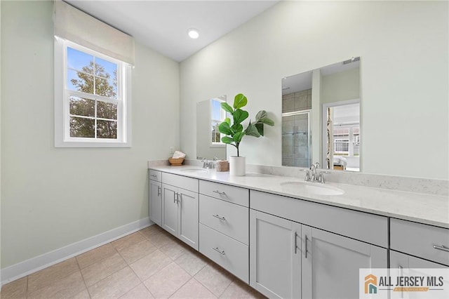 15 Galerie Ct, Monroe, NJ 08831 - bathroom with double vanity, plenty of natural light, a stall shower, and tile patterned flooring
