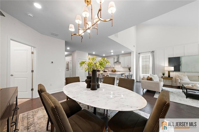 15 Galerie Ct, Monroe, NJ 08831 - dining area featuring wood finished floors, recessed lighting, a chandelier, and a high ceiling