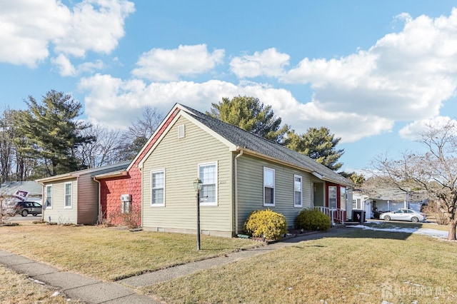 view of home's exterior with a yard