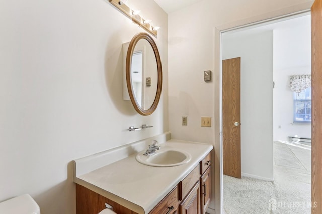 bathroom with vanity and toilet