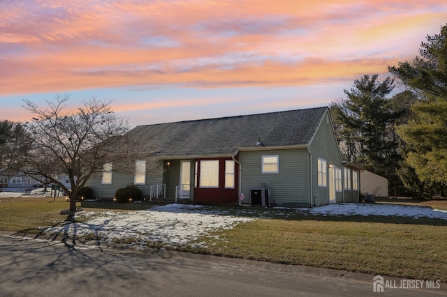 view of front of house with a yard