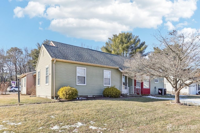 ranch-style house with central AC and a front yard