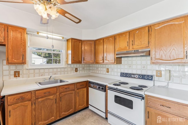 kitchen featuring sink, white appliances, tasteful backsplash, and ceiling fan