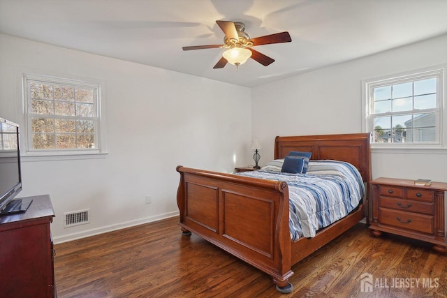 bedroom featuring dark wood-type flooring and ceiling fan