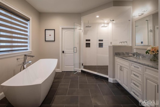 bathroom with shower with separate bathtub, tile patterned flooring, and vanity