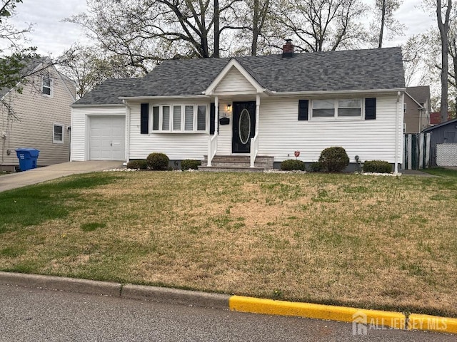 single story home featuring a garage, a chimney, a front lawn, a shingled roof, and driveway