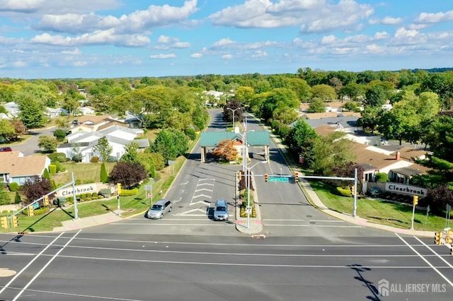 birds eye view of property with a residential view