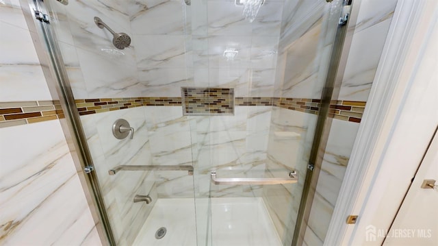 bathroom with a shower stall