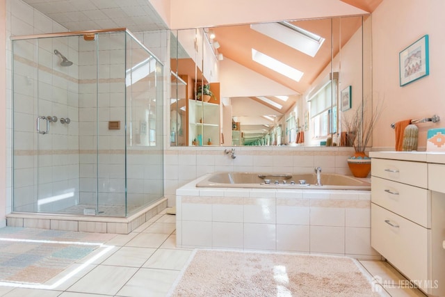 bathroom with tile patterned floors, lofted ceiling, plus walk in shower, and vanity