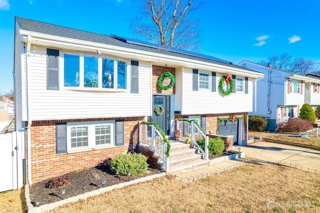 split foyer home featuring a garage