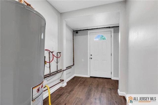 1092 Woodruff St, Iselin, NJ 08830 - entryway with water heater, wood finished floors, and baseboards