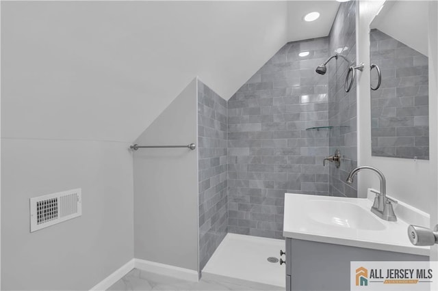 1092 Woodruff St, Iselin, NJ 08830 - full bathroom featuring vaulted ceiling, tiled shower, marble finish floors, vanity, and baseboards