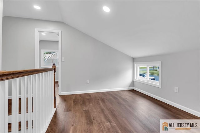 1092 Woodruff St, Iselin, NJ 08830 - spare room featuring lofted ceiling, dark wood-style flooring, healthy amount of natural light, baseboards, and recessed lighting